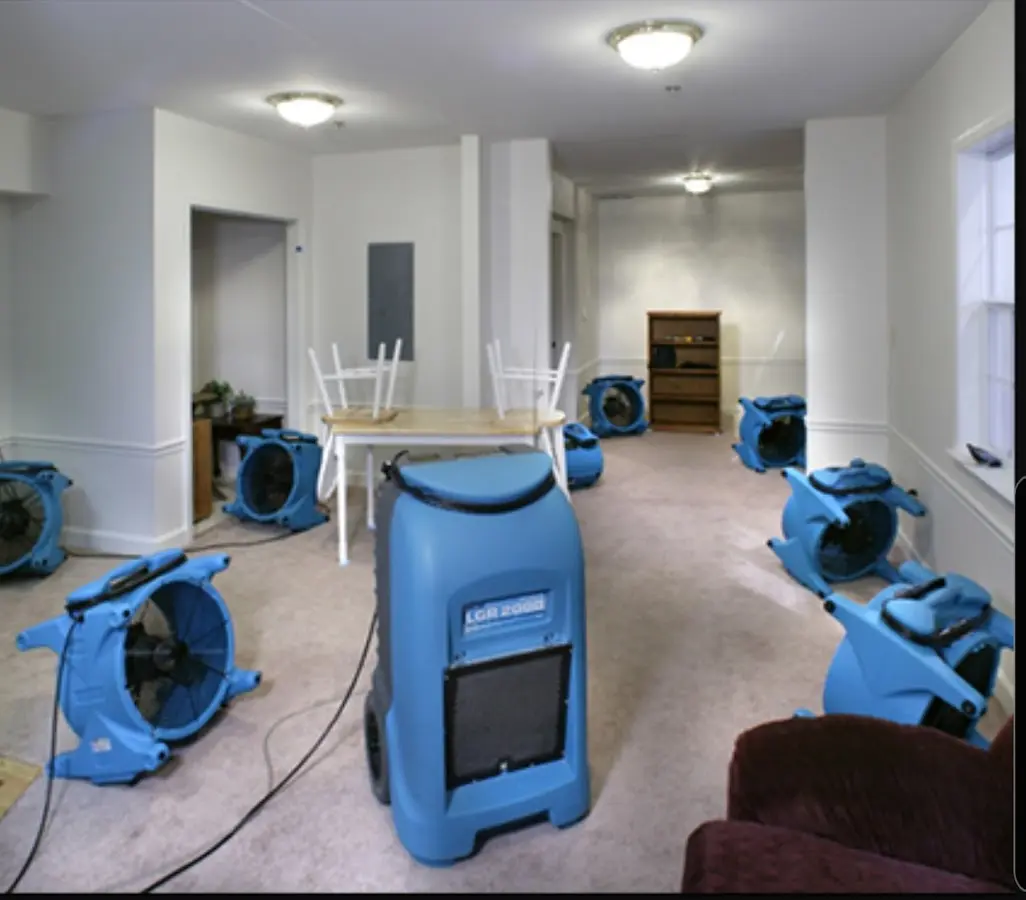 Air movers and dehumidifier setup for Water Damage Restoration in Darien